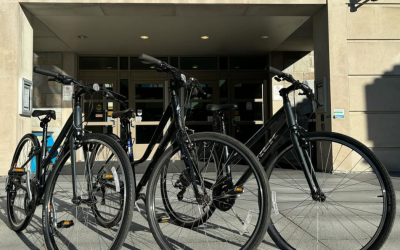 Three Tufts Bikes Share program bikes in front of the Tisch Library Entrance