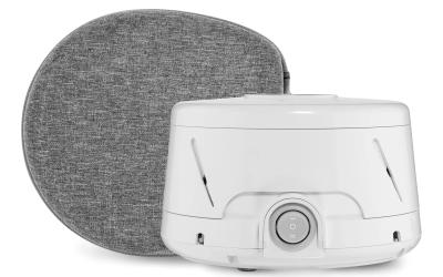 Photo of a white noise machine and its travel case