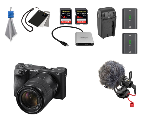 Sony camera, Rode microphone with mount, windscreen and 3.5mm cable, two batteries and charger, two SD cards and charger, lens cloth, white balance card