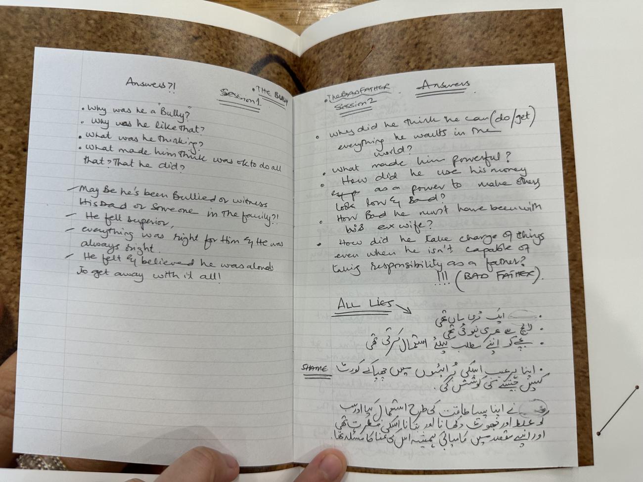 Handwritten text on the pages of an open book