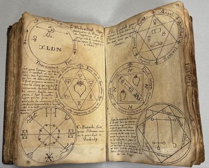 Two pages of Les Vrais Clavicules featuring pentacles and accompanying love spells