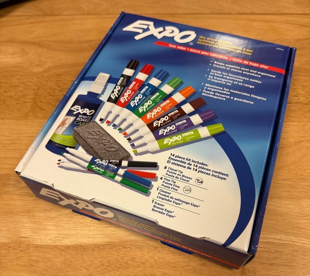 Original box from dry erase marker set showing the contents - 12 markers, an eraser and a bottle of cleaner