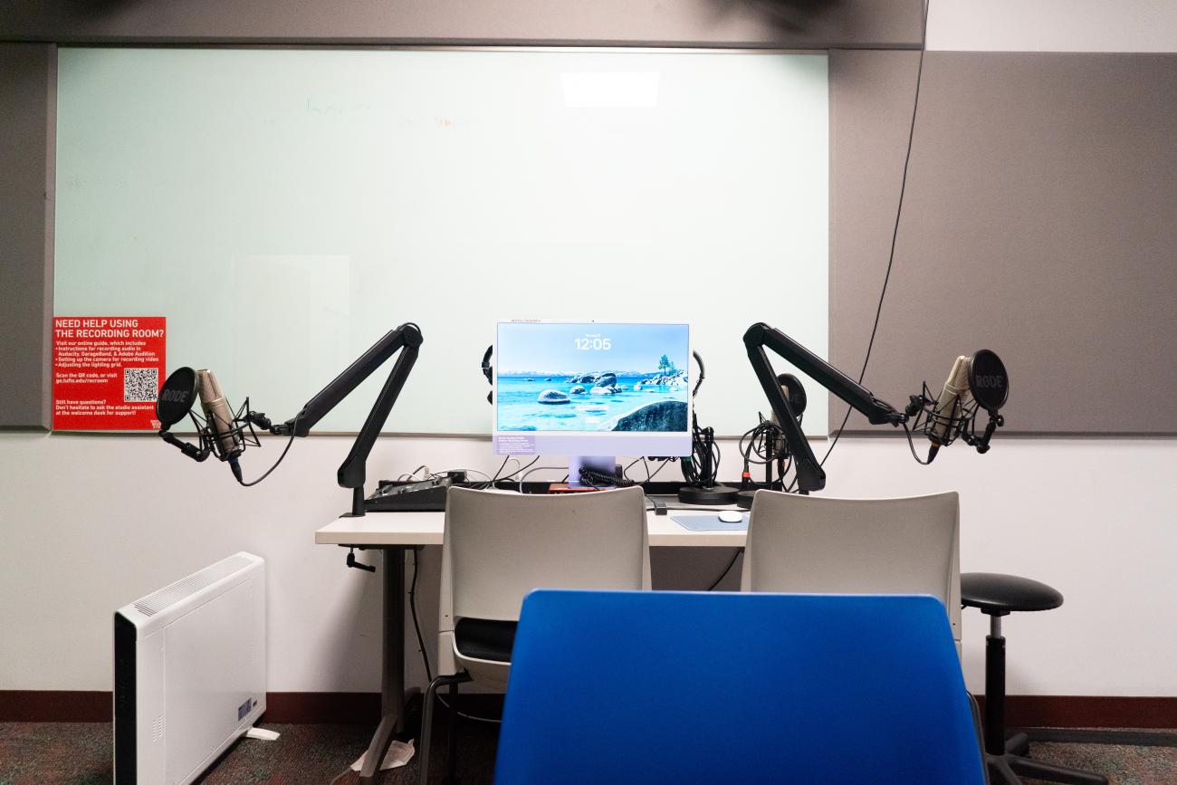 computer with two microphones on arms 