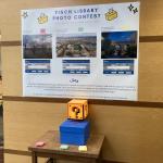 Photo contest voting table and poster with 3 photographs