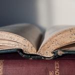 Open book set on top of another book