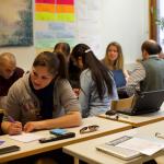 Classroom with adult students sitting at tables