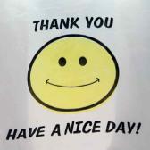 yellow smiley face with 'Thank you' above and 'have a nice day' below it from a plastic shopping bag