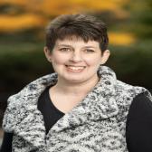 Headshot of librarian Stacey Brownlie a white woman with brown hair